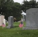 American flags are placed at headstones as part of “Flags In” in Arlington National Cemetery, Arlington, Va., May 22, 2025.