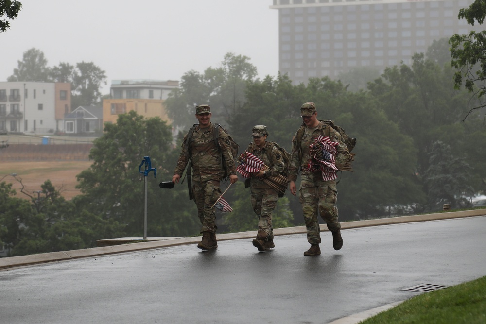 Soldiers from the 3d U.S. Infantry Regiment (The Old Guard) return from placing American flags at headstones as part of “Flags In” at Arlington National Cemetery, Arlington, Va., May 22, 2025.