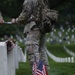 Soldiers from the 3d U.S. Infantry Regiment (The Old Guard) place American flags at headstones during “Flags In” at Arlington National Cemetery, Arlington, Va., May 22, 2025.