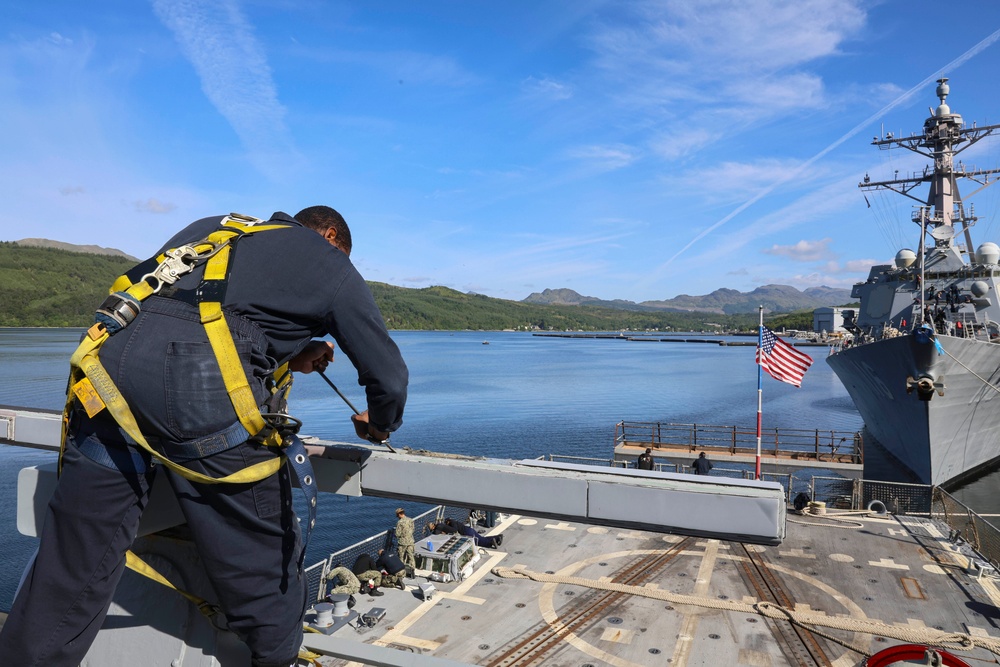 Cryptologic Technician (Technical) 2nd Class Darren Grant  scrapes, cleans and prepares surfaces for preservation and painting