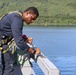 Cryptologic Technician (Technical) 2nd Class Darren Grant prepares surfaces for preservation