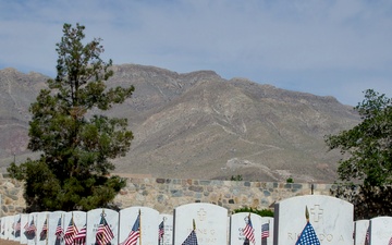 Flags placed at Fort Bliss National Cemetery before Memorial Day