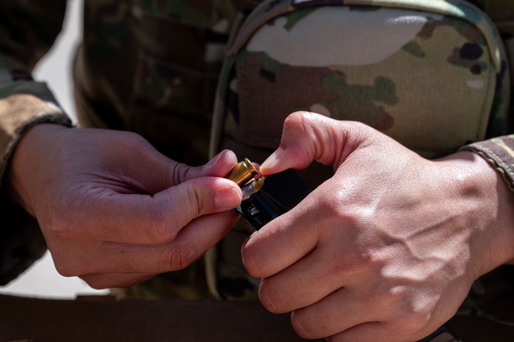 Members of 332nd Air Expeditionary Wing quick strike team qualify on M18 pistol
