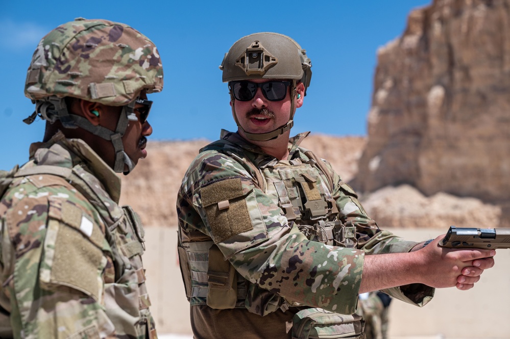 Members of 332nd Air Expeditionary Wing quick strike team qualify on M18 pistol