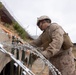 U.S. Marines with Task Force Sapper adjust concertina wire