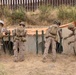 U.S. Marines with Task Force Sapper adjust concertina wire
