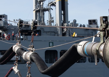 USS Benfold (DDG 65) conducts a replenishment at sea in the South China Sea