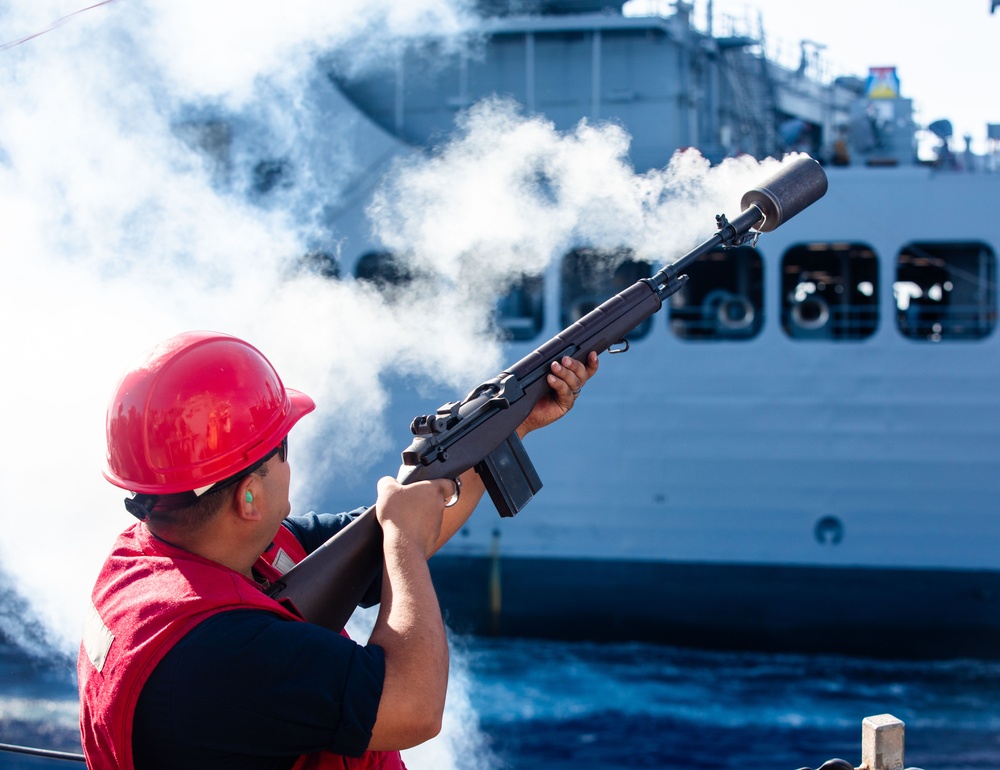 USS Benfold (DDG 65) conducts a replenishment at sea in the South China Sea