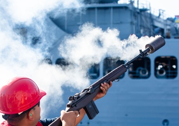 USS Benfold (DDG 65) conducts a replenishment at sea in the South China Sea