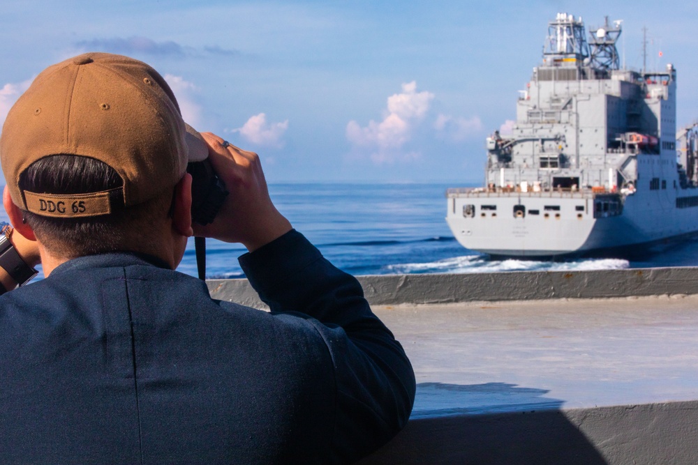 USS Benfold (DDG 65) conducts a replenishment at sea in the South China Sea
