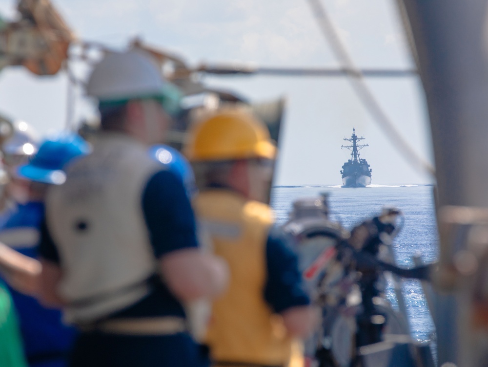 USS Benfold (DDG 65) conducts a replenishment at sea in the South China Sea