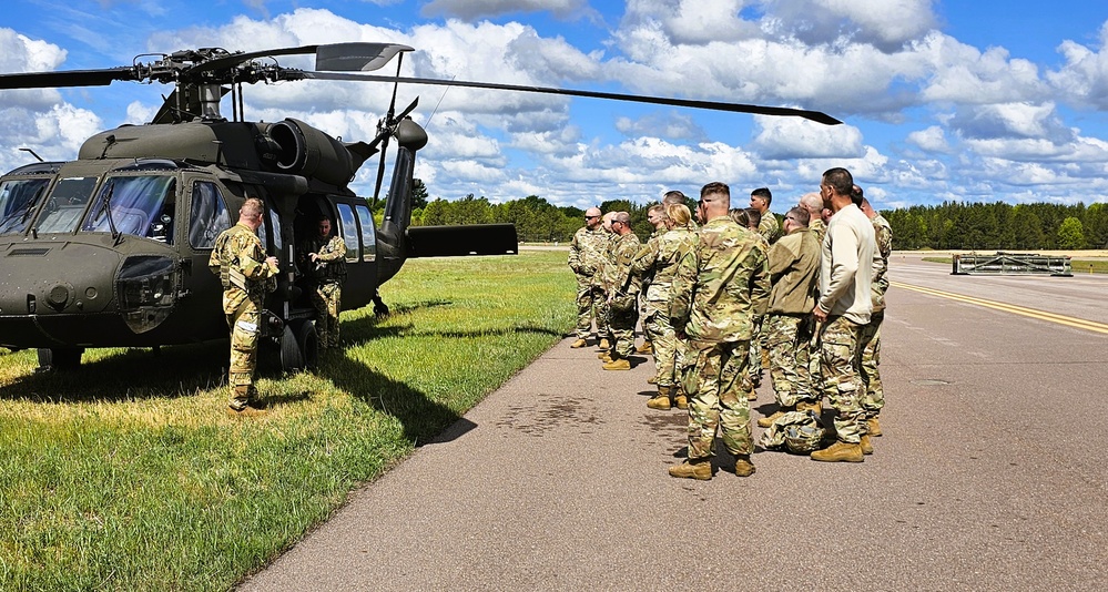 Soldiers with 13th Battalion, 100th Regiment hold slingload training at McCoy, Wisconsin National Guard Black Hawks, crews assist