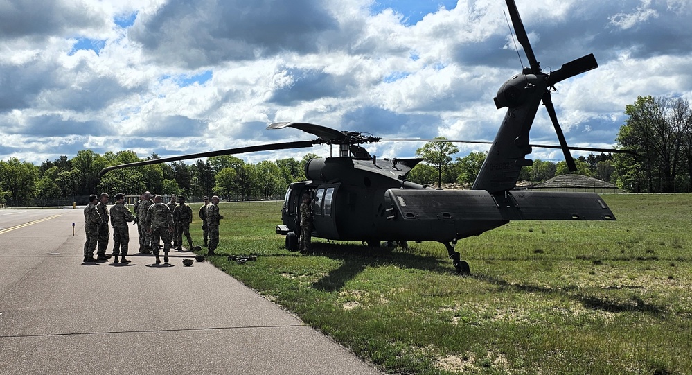 Soldiers with 13th Battalion, 100th Regiment hold slingload training at McCoy, Wisconsin National Guard Black Hawks, crews assist