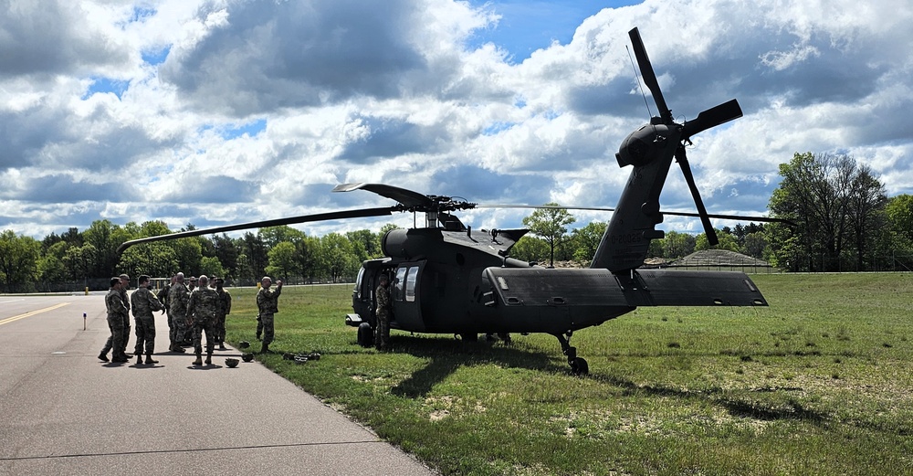 Soldiers with 13th Battalion, 100th Regiment hold slingload training at McCoy, Wisconsin National Guard Black Hawks, crews assist