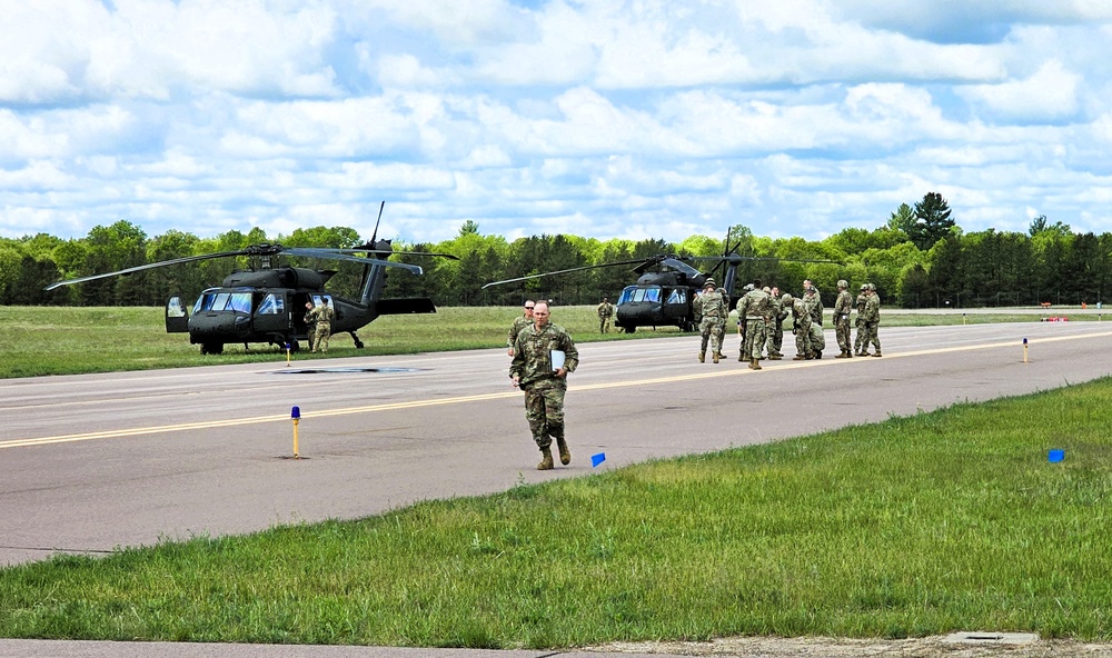 Soldiers with 13th Battalion, 100th Regiment hold slingload training at McCoy, Wisconsin National Guard Black Hawks, crews assist