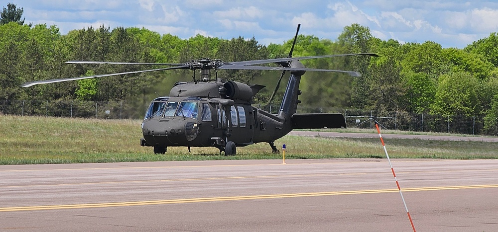 Soldiers with 13th Battalion, 100th Regiment hold slingload training at McCoy, Wisconsin National Guard Black Hawks, crews assist