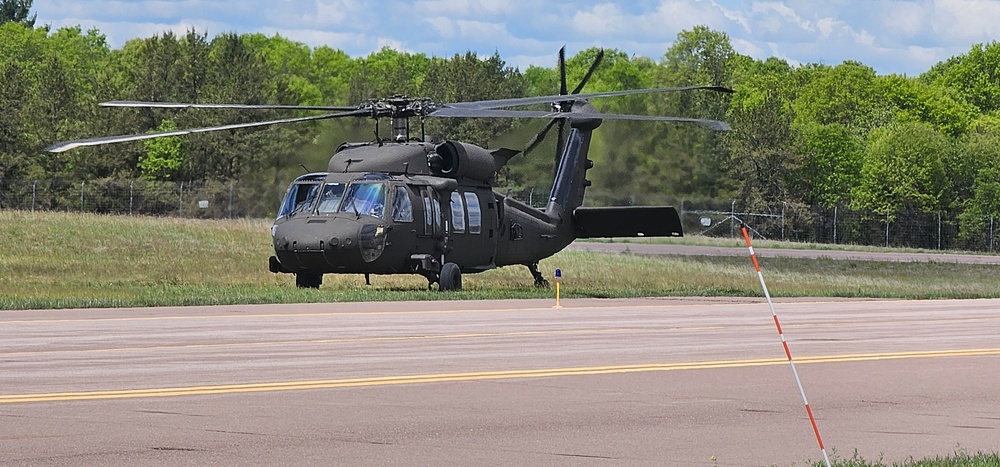 Soldiers with 13th Battalion, 100th Regiment hold slingload training at McCoy, Wisconsin National Guard Black Hawks, crews assist