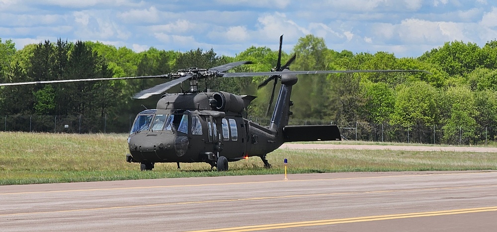 Soldiers with 13th Battalion, 100th Regiment hold slingload training at McCoy, Wisconsin National Guard Black Hawks, crews assist