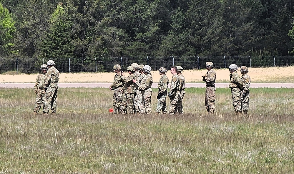 Soldiers with 13th Battalion, 100th Regiment hold slingload training at McCoy, Wisconsin National Guard Black Hawks, crews assist