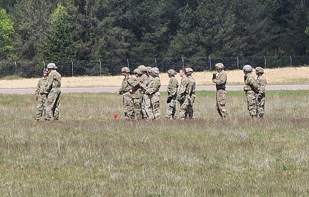 Soldiers with 13th Battalion, 100th Regiment hold slingload training at McCoy, Wisconsin National Guard Black Hawks, crews assist