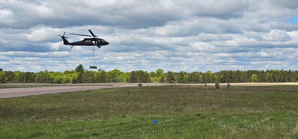Soldiers with 13th Battalion, 100th Regiment hold slingload training at McCoy, Wisconsin National Guard Black Hawks, crews assist