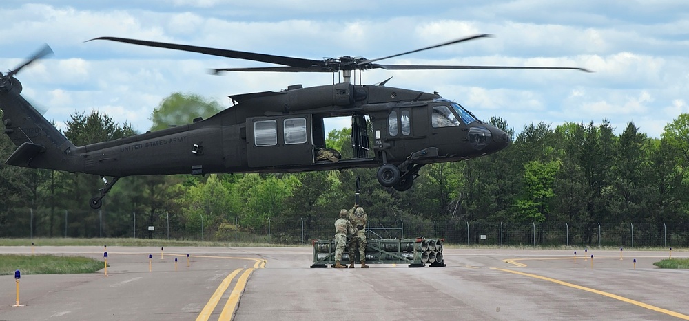 Soldiers with 13th Battalion, 100th Regiment hold slingload training at McCoy, Wisconsin National Guard Black Hawks, crews assist