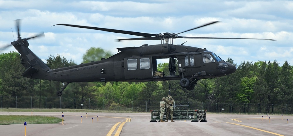 Soldiers with 13th Battalion, 100th Regiment hold slingload training at McCoy, Wisconsin National Guard Black Hawks, crews assist