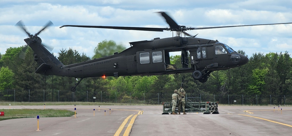 Soldiers with 13th Battalion, 100th Regiment hold slingload training at McCoy, Wisconsin National Guard Black Hawks, crews assist