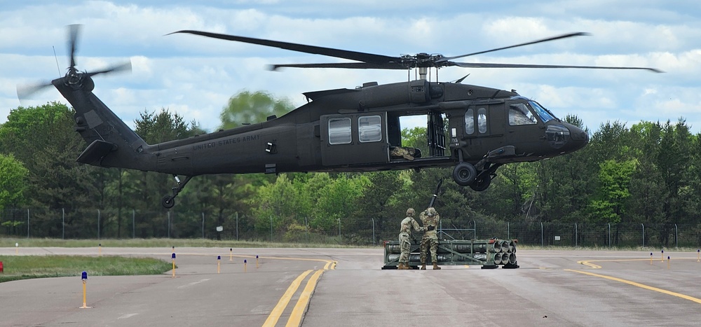 Soldiers with 13th Battalion, 100th Regiment hold slingload training at McCoy, Wisconsin National Guard Black Hawks, crews assist