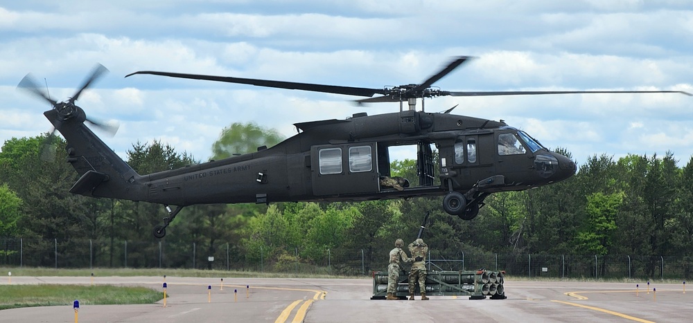 Soldiers with 13th Battalion, 100th Regiment hold slingload training at McCoy, Wisconsin National Guard Black Hawks, crews assist