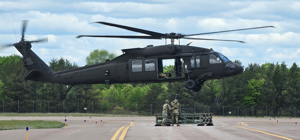 Soldiers with 13th Battalion, 100th Regiment hold slingload training at McCoy, Wisconsin National Guard Black Hawks, crews assist