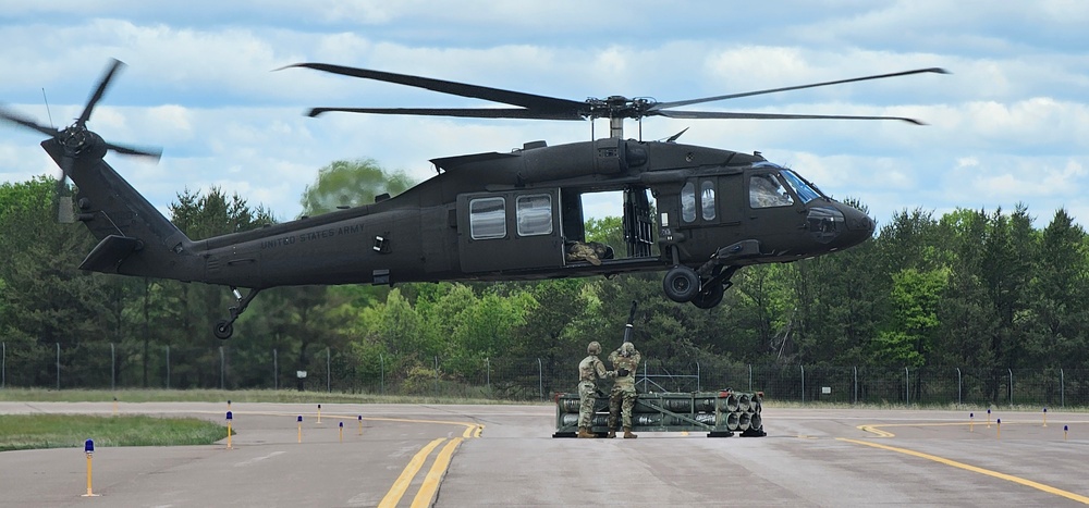Soldiers with 13th Battalion, 100th Regiment hold slingload training at McCoy, Wisconsin National Guard Black Hawks, crews assist