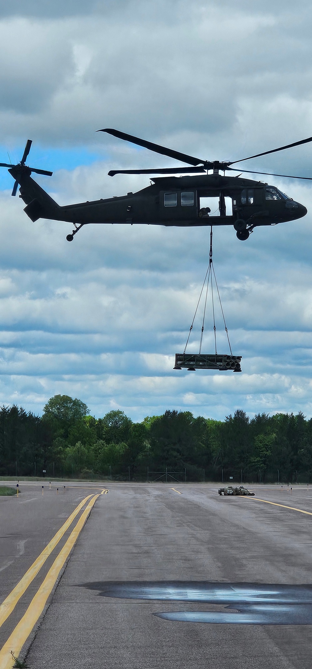 Soldiers with 13th Battalion, 100th Regiment hold slingload training at McCoy, Wisconsin National Guard Black Hawks, crews assist