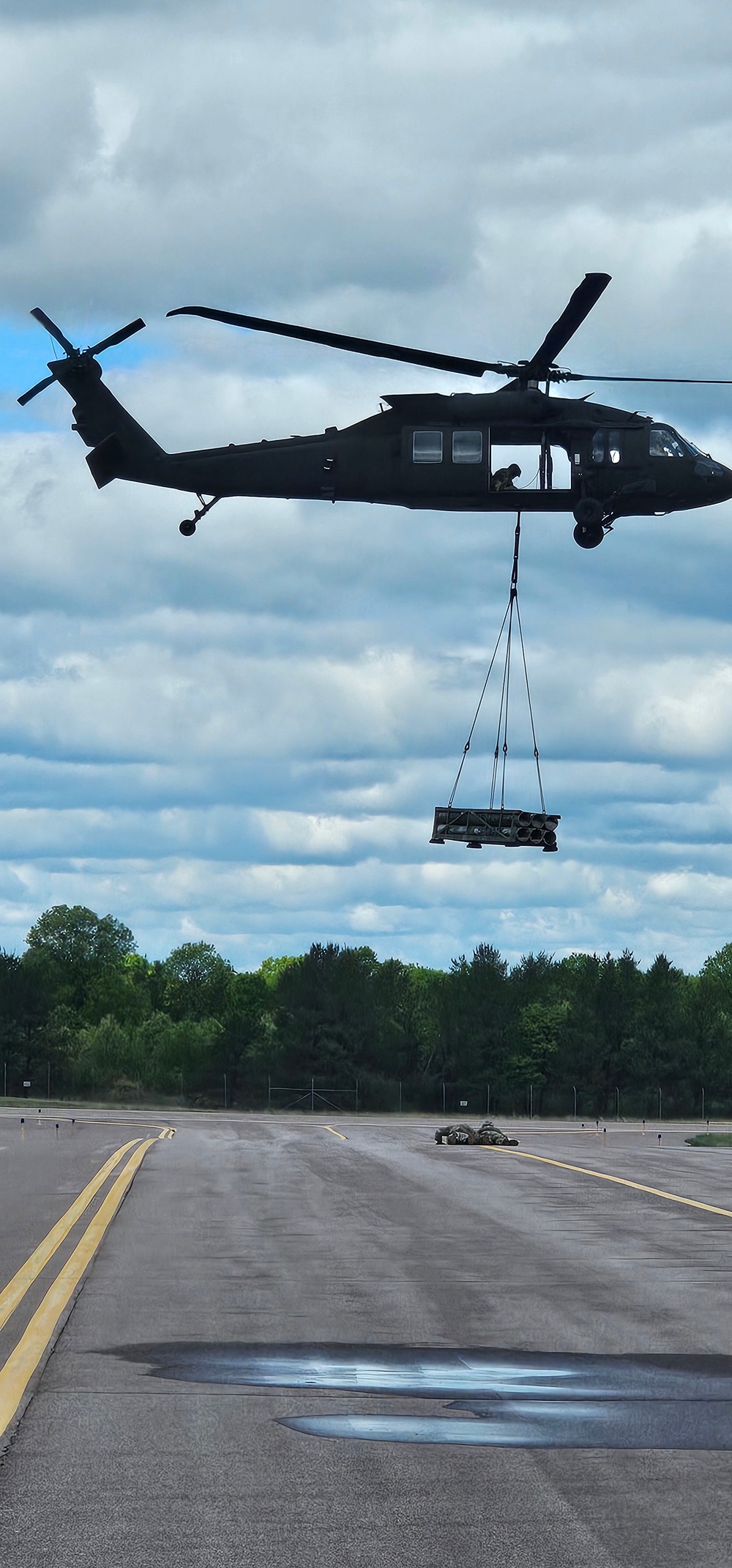 Soldiers with 13th Battalion, 100th Regiment hold slingload training at McCoy, Wisconsin National Guard Black Hawks, crews assist