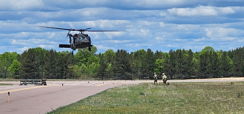 Soldiers with 13th Battalion, 100th Regiment hold slingload training at McCoy, Wisconsin National Guard Black Hawks, crews assist