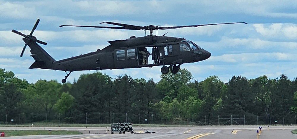Soldiers with 13th Battalion, 100th Regiment hold slingload training at McCoy, Wisconsin National Guard Black Hawks, crews assist