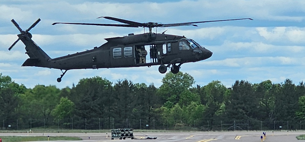 Soldiers with 13th Battalion, 100th Regiment hold slingload training at McCoy, Wisconsin National Guard Black Hawks, crews assist