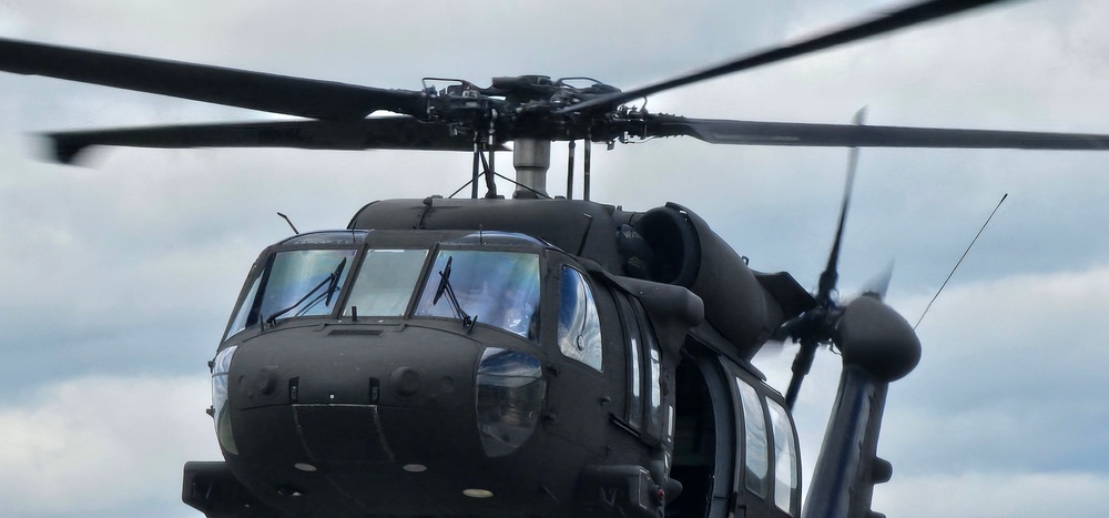 Soldiers with 13th Battalion, 100th Regiment hold slingload training at McCoy, Wisconsin National Guard Black Hawks, crews assist