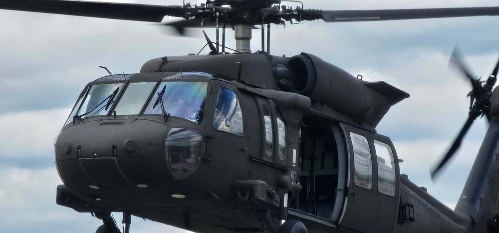 Soldiers with 13th Battalion, 100th Regiment hold slingload training at McCoy, Wisconsin National Guard Black Hawks, crews assist