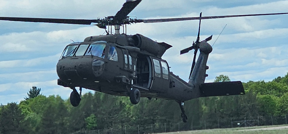 Soldiers with 13th Battalion, 100th Regiment hold slingload training at McCoy, Wisconsin National Guard Black Hawks, crews assist
