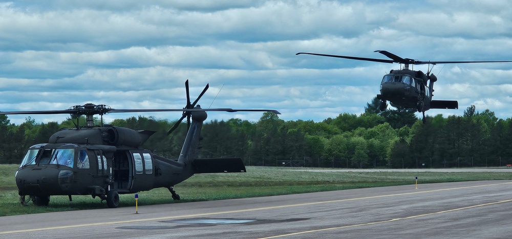 Soldiers with 13th Battalion, 100th Regiment hold slingload training at McCoy, Wisconsin National Guard Black Hawks, crews assist