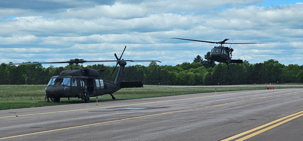 Soldiers with 13th Battalion, 100th Regiment hold slingload training at McCoy, Wisconsin National Guard Black Hawks, crews assist
