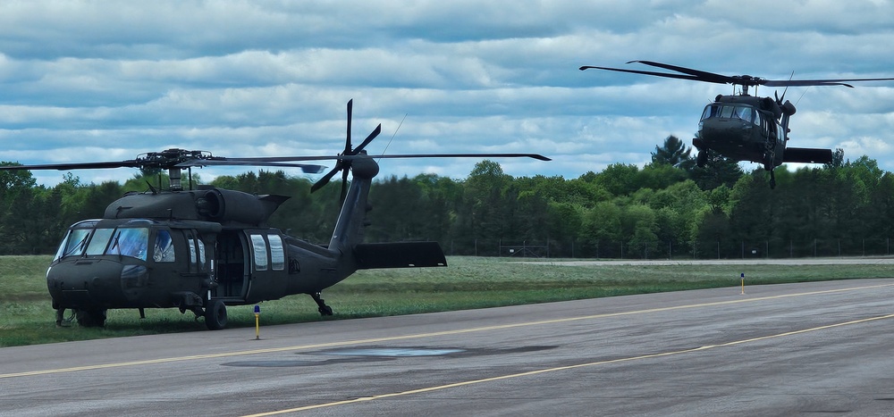 Soldiers with 13th Battalion, 100th Regiment hold slingload training at McCoy, Wisconsin National Guard Black Hawks, crews assist