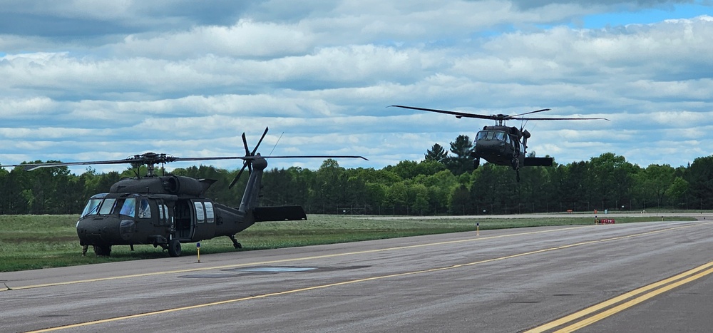 Soldiers with 13th Battalion, 100th Regiment hold slingload training at McCoy, Wisconsin National Guard Black Hawks, crews assist