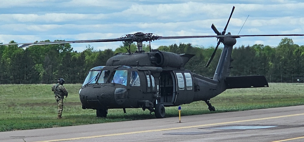 Soldiers with 13th Battalion, 100th Regiment hold slingload training at McCoy, Wisconsin National Guard Black Hawks, crews assist
