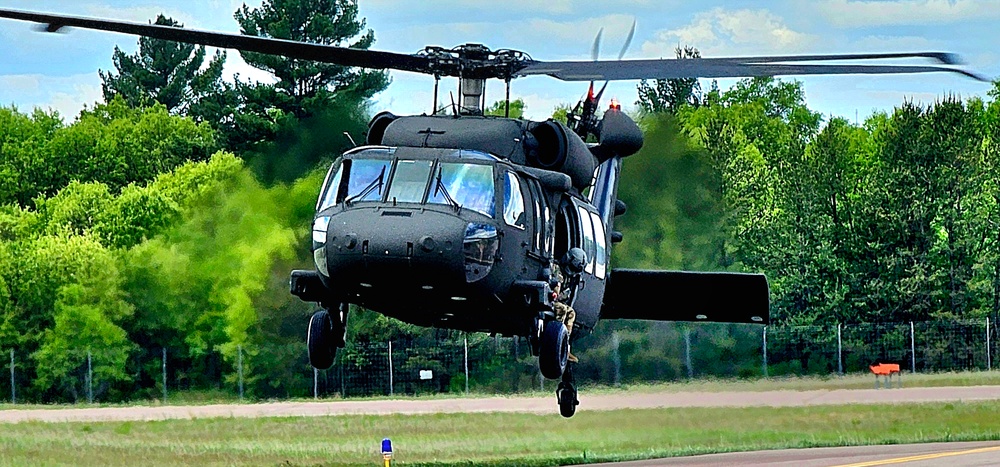 Soldiers with 13th Battalion, 100th Regiment hold slingload training at McCoy, Wisconsin National Guard Black Hawks, crews assist