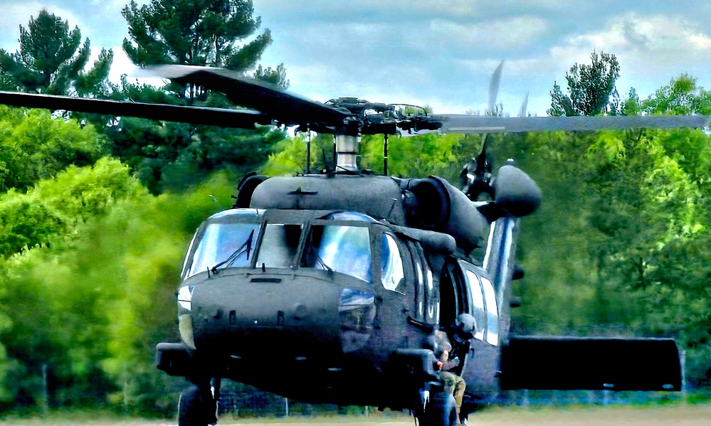 Soldiers with 13th Battalion, 100th Regiment hold slingload training at McCoy, Wisconsin National Guard Black Hawks, crews assist