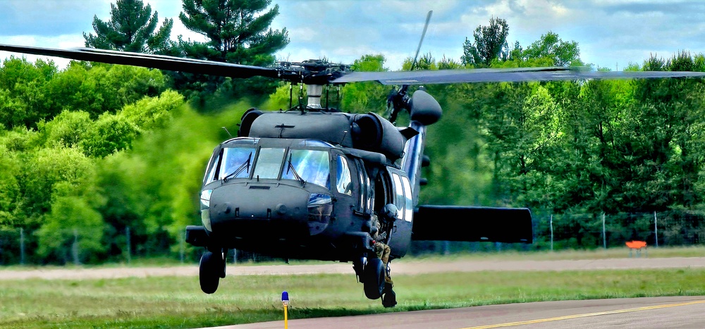Soldiers with 13th Battalion, 100th Regiment hold slingload training at McCoy, Wisconsin National Guard Black Hawks, crews assist