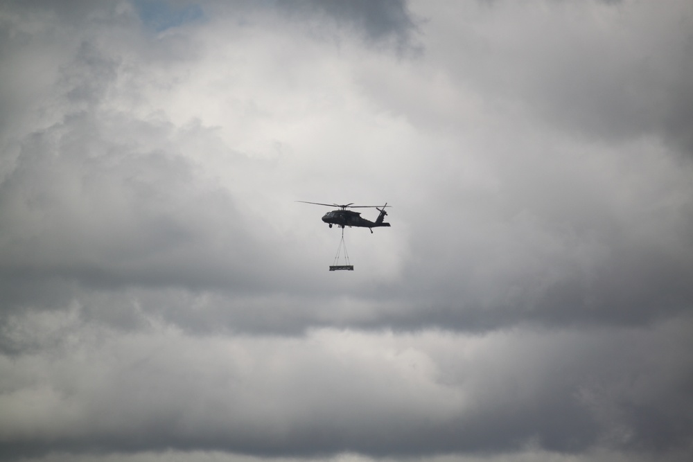 Soldiers with 13th Battalion, 100th Regiment hold slingload training at McCoy, Wisconsin National Guard Black Hawks, crews assist