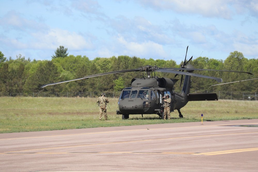 Soldiers with 13th Battalion, 100th Regiment hold slingload training at McCoy, Wisconsin National Guard Black Hawks, crews assist